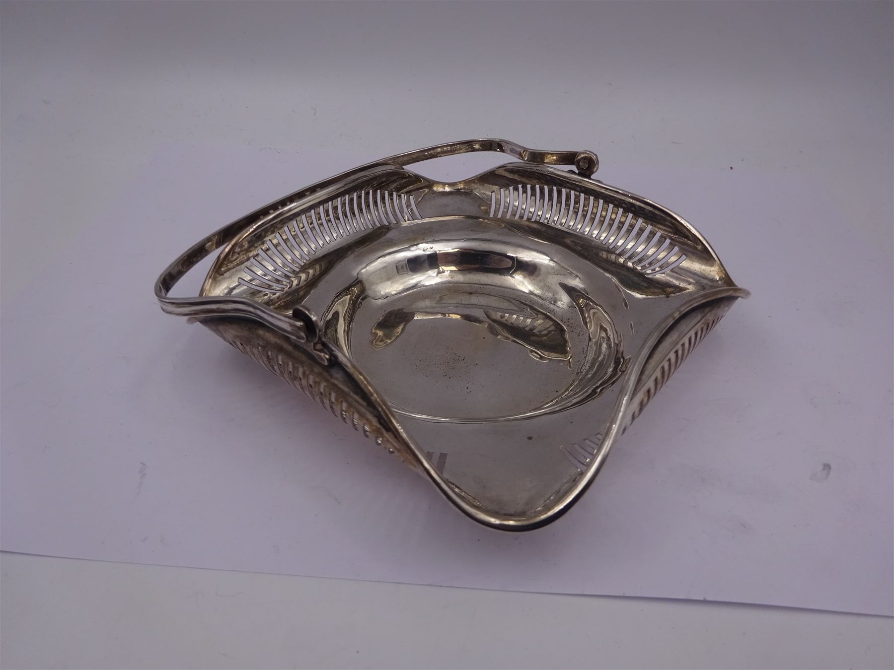 Early 20th century Chinese export silver swing handled basket, of square form with rounded corners and curled, pierced rim, stamped SF 90 with character marks beneath, maker probably Sing Fat, W12.5cm, including handle H11cm