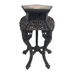 Late 19th to early 20th century Chinese carved hardwood jardinière or urn stand, pentagon top with circular marble inset and beaded edge, carved and pierced with floral decoration, five shaped supports carved with trailing foliate