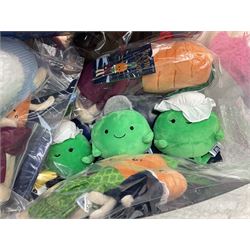 Three large ALDI Kevin carrots and giant unicorn stuffed toy together with quantity of smaller carrots