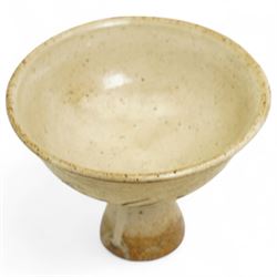 Chinese Song Dynasty (960–1279) Cizhou polychrome decorated wine stem cup, deep rounded sides over tall flared foot, decorated in iron-brown slip with stylized floral spray on a creamy-white slip ground beneath a clear glaze, base of foot unglazed, W11cm H8cm