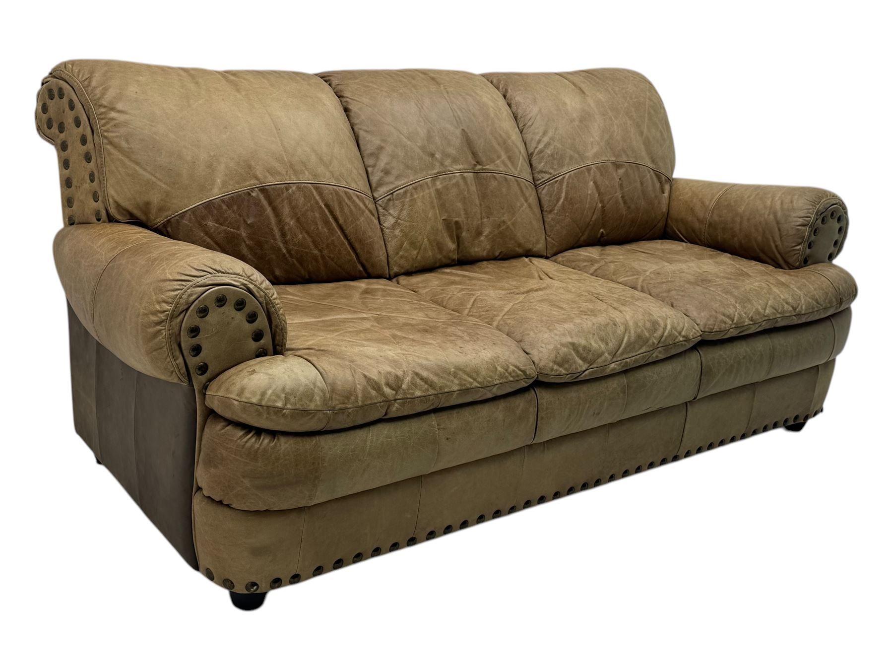 Contemporary three-seat sofa, upholstered in stitched brown leather with brass studwork decoration, rolled back and arms, raised on turned supports