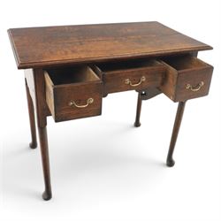 18th century oak lowboy, rectangular plank top with moulded edge, above three assorted drawers with brass swan neck handles, shaped apron raised on pad feet