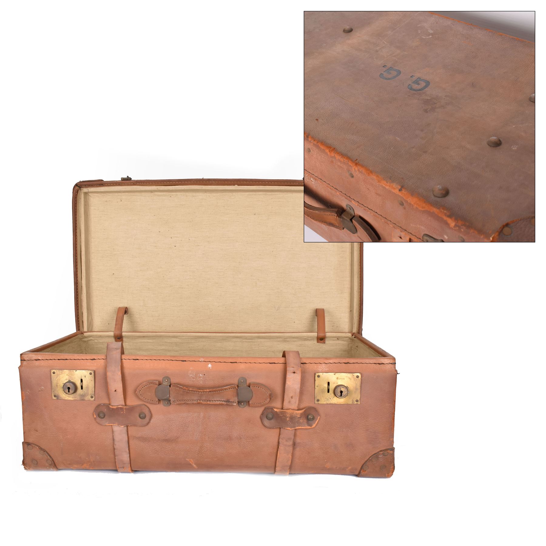 Early 20th century leather trunk, with brass fixtures, leather straps and buckle fastenings, embossed to the top with initials GG, H28cm, W76cm