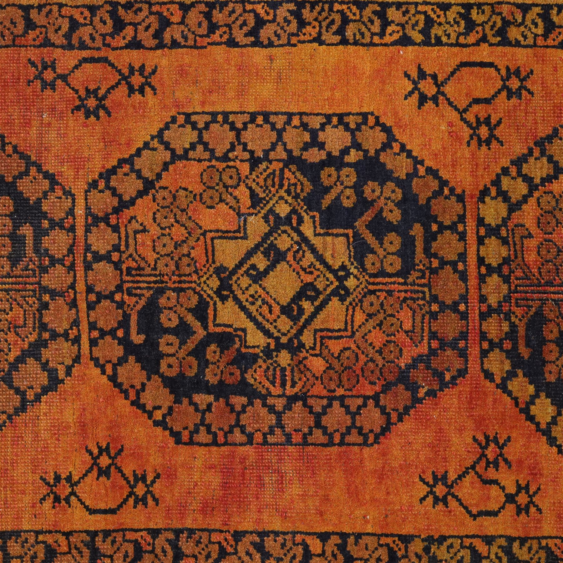 Afghan Ersari hand-knotted rug, apricot field decorated with three large octagonal gul medallions filled with geometric floral motifs, flanked by small tribal devices, end fringe fraying 97x167cm, together with a Baluch prayer rug, decorated with stylized tree motifs arranged in vertical rows beneath a stepped mihrab arch with multiple narrow borders of angular tribal motifs in shades of indigo, brown, and ochre fraying to flatweave ends, 134x84cm, (2)