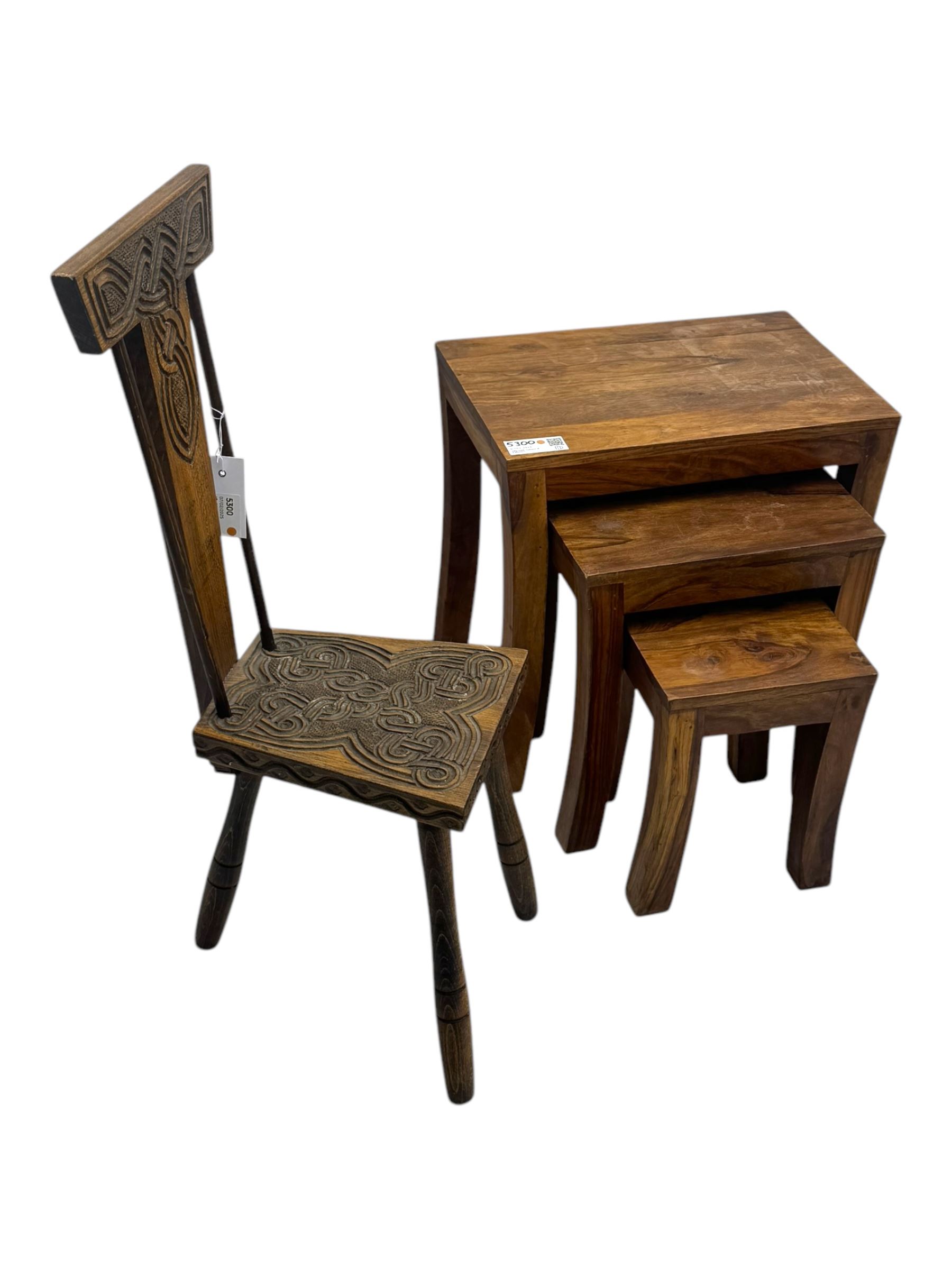 Early 20th century Celtic-design carved oak hall chair, decorated with carved interlacing knot motifs, raised on three splayed supports (W24cm, D26cm, H79cm); nest of three hardwood tables, rectangular tops raised on curved and splayed supports (W45cm, D30cm, H46cm) 