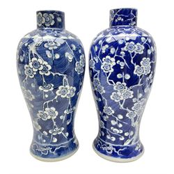 Two Chinese Prunus pattern jars, each of slender baluster form, lacking covers, H31cm