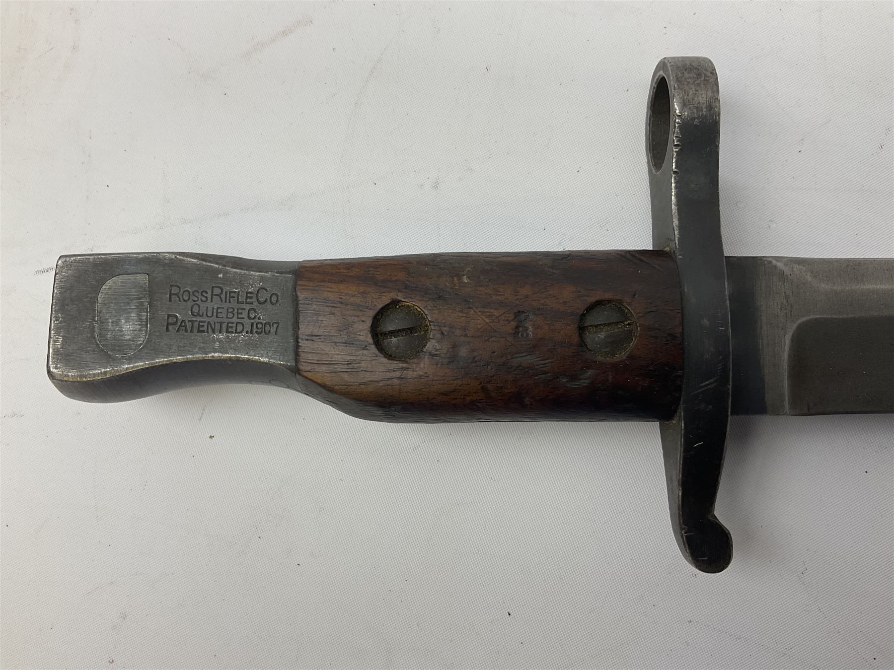 WW1 American Remington P14 rifle bayonet Model 1913, the 43cm fullered steel blade dated 5 17; in metal mounted leather scabbard L57cm overall; and WW1 Canadian Ross Rifle Co.1907 Model Mk.II bayonet, dated 2/17; in leather scabbard with frog (2)