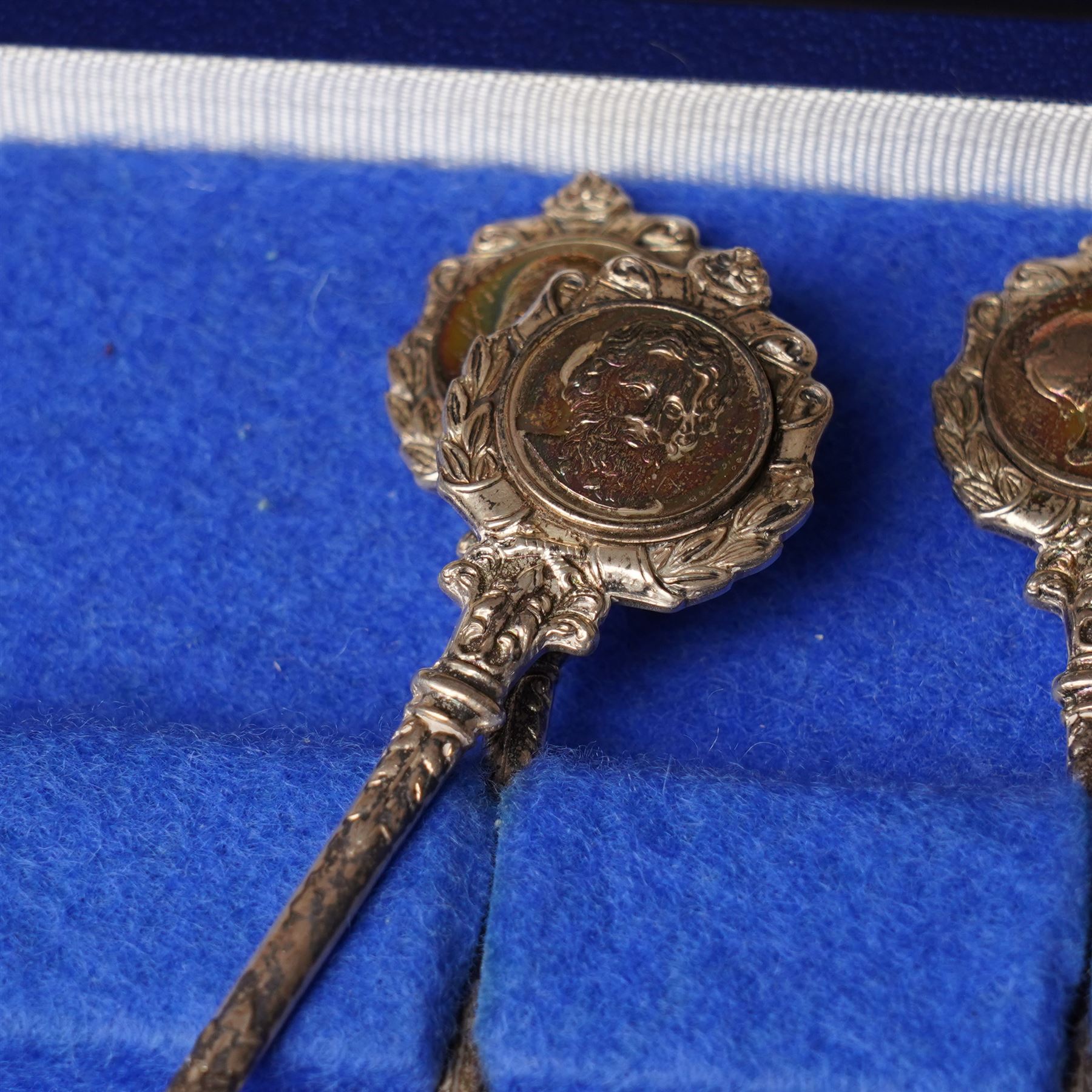 'The Twelve Roman Spoons' a set of twelve silver spoons each with the head of a Deity in fitted case London 1971 Maker John Pinches