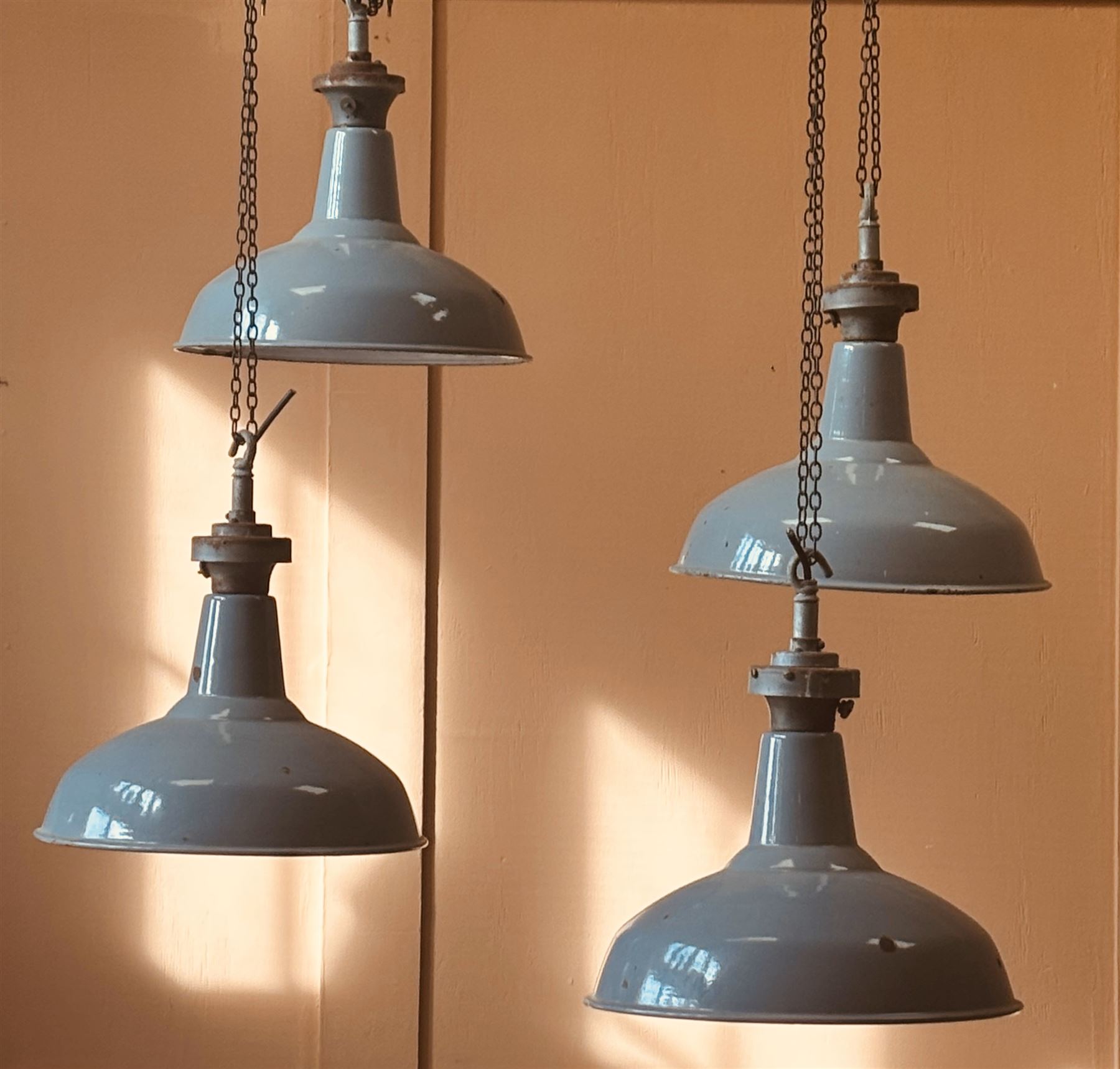 Set of four industrial grey enamel pendent light fittings, mid 20th century. H48cm, D41cm.  - COLLECTION BY APPOINTMENT FROM: The White House, Thirsk Road, Easingwold, York, YO61 3NF - CALL 01723 507111 TO ARRANGE