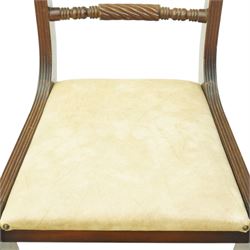 Late 20th century Regency style mahogany dining chairs, set of four, bar backs with figured veneered top rails and turned spindle stretchers, drop-in seats upholstered in beige leather, on moulded sabre supports