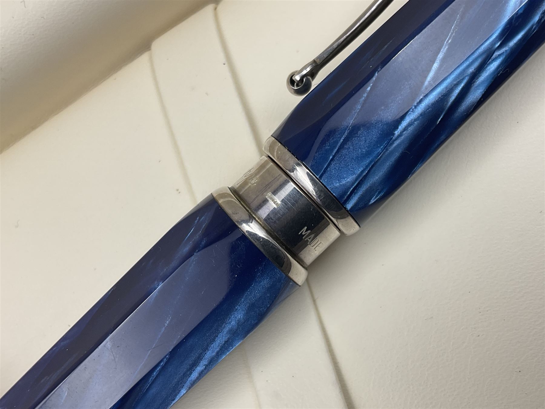 Montegrappa Emblema fountain pen, the blue pearl marbled barrel of octagonal form with silver mounts stamped 925 and silver mounted cap with 1912 emblem and clip with roller, in box, L13.5cm