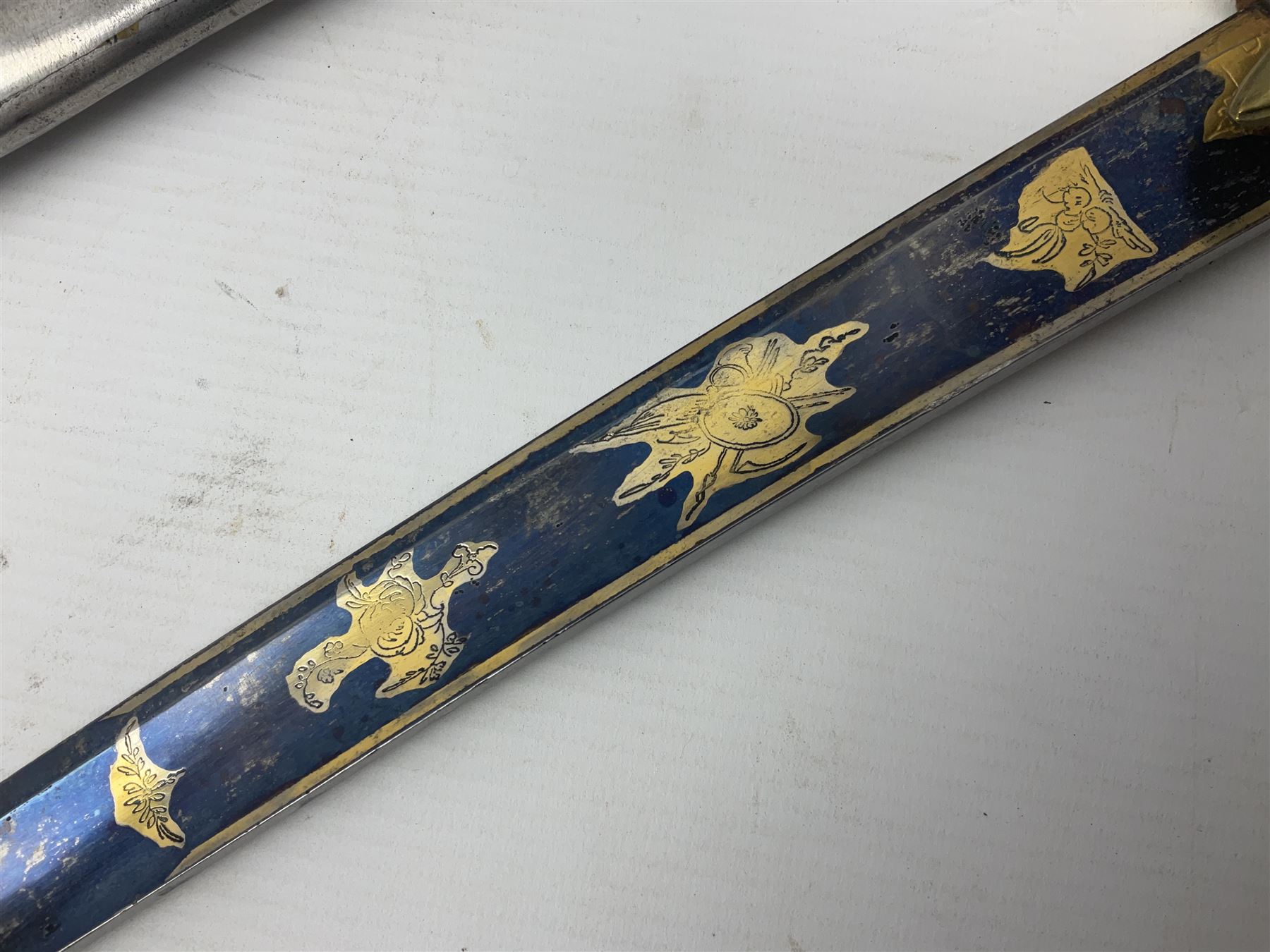 Early 19th century French Lancers officer's sword c1810, the 84cm curving fullered blade retaining most of its bluing, gilding and engraved decoration, inscribed I.S.& C. to ricasso (for Schimelbusch), brass three-bar hilt with elongated elliptical langets and wire-bound leather grip; in polished steel scabbard with two brass suspension rings L100cm overall
