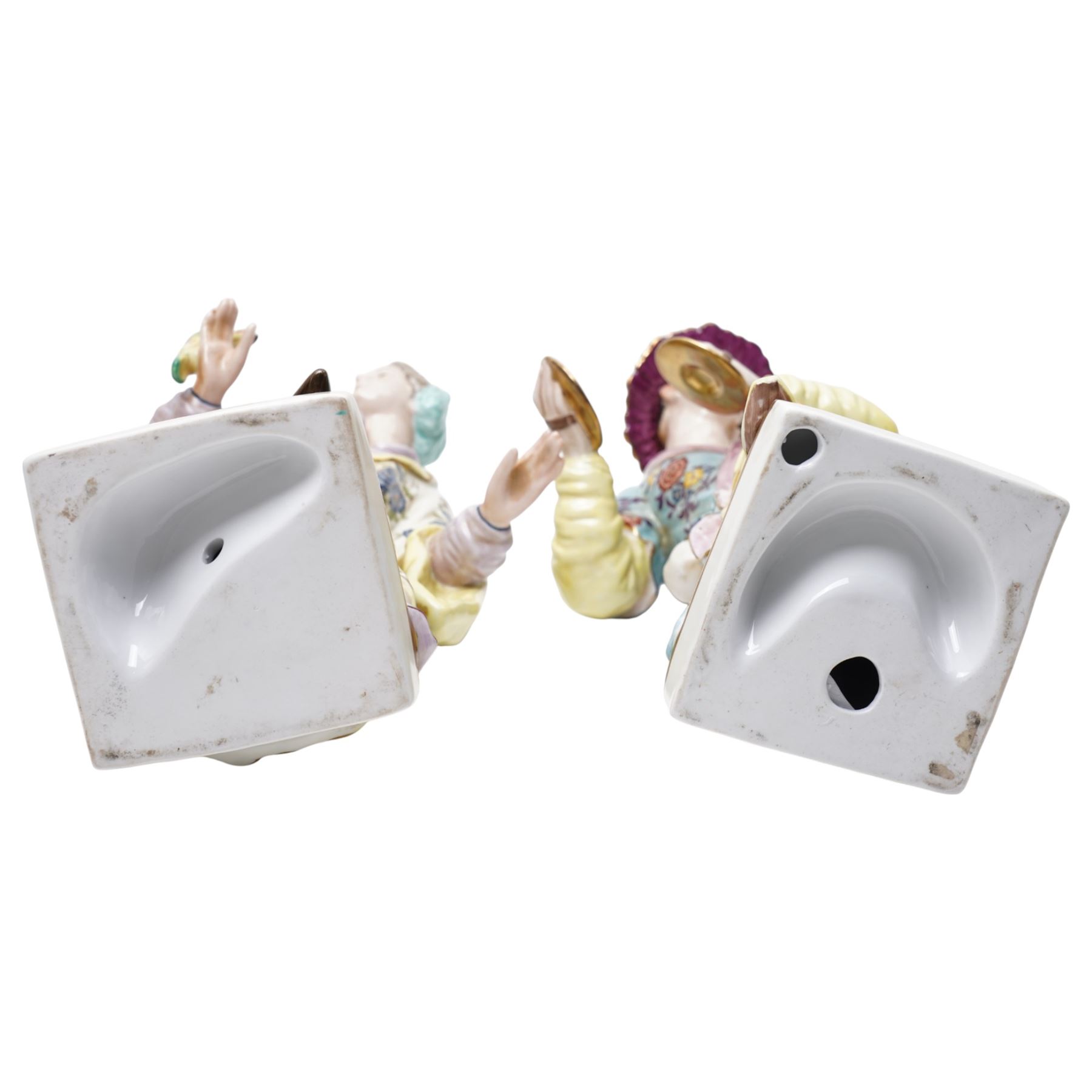 Pair of Continental polychrome Chinese male and female standing figures wearing floral robes H42cm