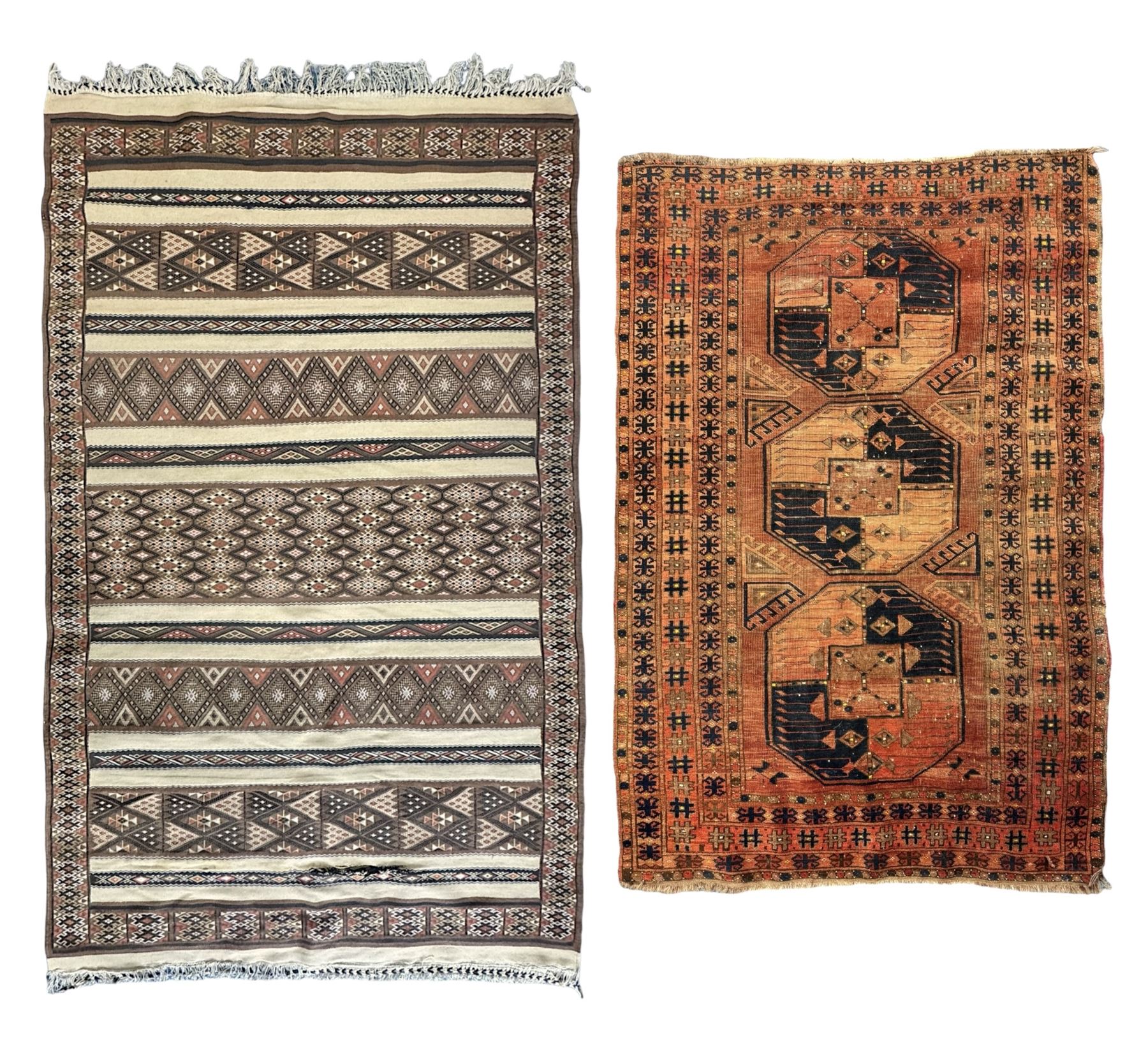 Turkish Kilim ground rug, the field with alternating horizontal bands of geometric patterns, bordered by repeating diamond motifs (145cm x 242cm); Turkish red ground rug, the field with three octagonal medallions (113cm x 172cm) (2)