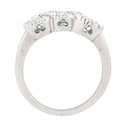 18ct white gold emerald and diamond triple cluster ring, three round cut emeralds, surrounded by round brilliant cut diamonds, the gallery with pierced trefoil motifs, stamped, total emerald weight approx 0.30 carat, total diamond weight approx 0.30 carat