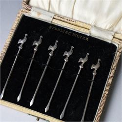 Set of six silver cocktail sticks, each with cockerel finials, stamped Sterling Silver, in fitted case