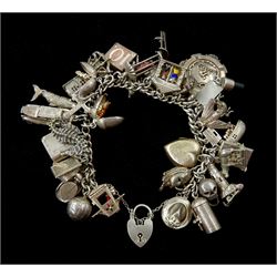 Silver charm bracelet, charms including monkey in a cage, squirrel in an acorn, seahorse, skull, lighthouse, Noah's ark, touch wood, fly, The old Smithy, dachshund, highland dancer in bagpipes and Romulus and Remus
