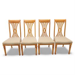 Late 20th century parquetry veneered extending dining table and eight chairs, the rectangular top with canted corners decorated with geometric parquetry panels, moulded edge frieze with repeating carved detail, raised on twin pedestal supports with fluted columns and shaped platform bases, the chairs with pierced splat backs and upholstered drop-in seats
Extends on a central leaf to 208cm