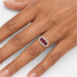 18ct gold ruby and diamond cluster ring, three oval cut rubies surrounded by eighteen single cut diamonds, London 1979, total ruby weight approx 0.55 carat, total diamond weight approx 0.20 carat