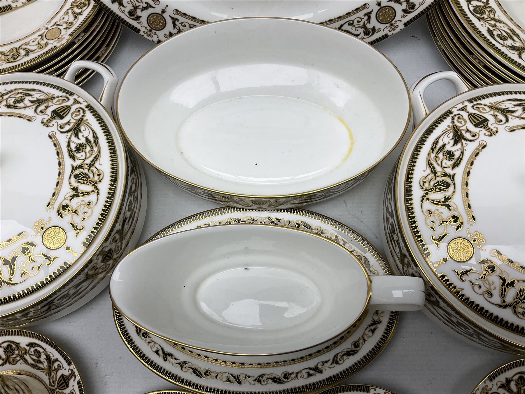 Royal Worcester Windsor pattern part tea and dinner service, comprising nine dinner plates, nine side plates, nine dessert plates, six coffee cans and saucers, sauce boat and plate, two covered tureens, oval dish and serving platter (35)