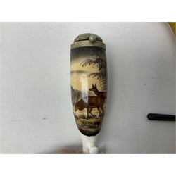 Carved meerschaum and amber pipe with silver mount, the bowl carved as a woman, cased, clay pipe in the form of an acorn, ceramic pipe, five other pipes and a ceramic bottle pourer in the form of a horse  