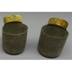  Set of seventy two 20th century tin pay/wage cups, numbered in brass 73-1, each H5.5cm, case W71cm  