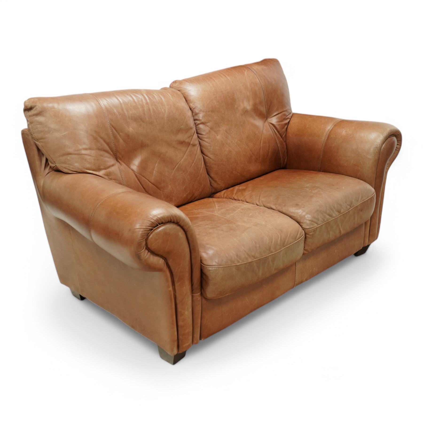 Two-seat hardwood-framed sofa, traditional shape with rolled arms, upholstered in tan leather, on block feet