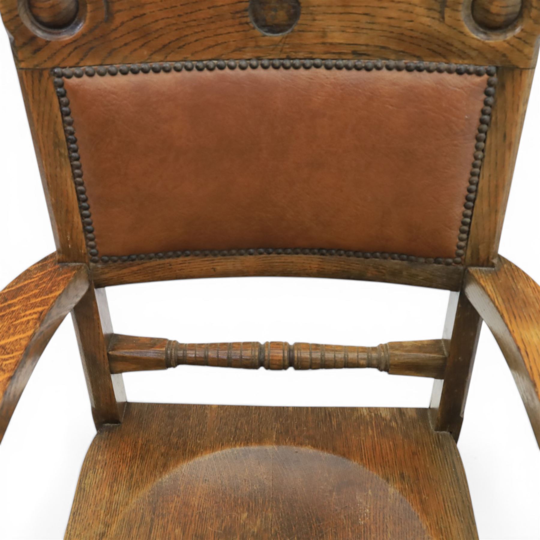 Arts and Crafts oak open armchair with dished seat