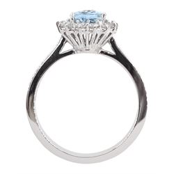 18ct white gold oval aquamarine and round brilliant cut cluster ring, hallmarked, aquamarine approx 1.05 carat, total diamond weight approx 0.40 carat