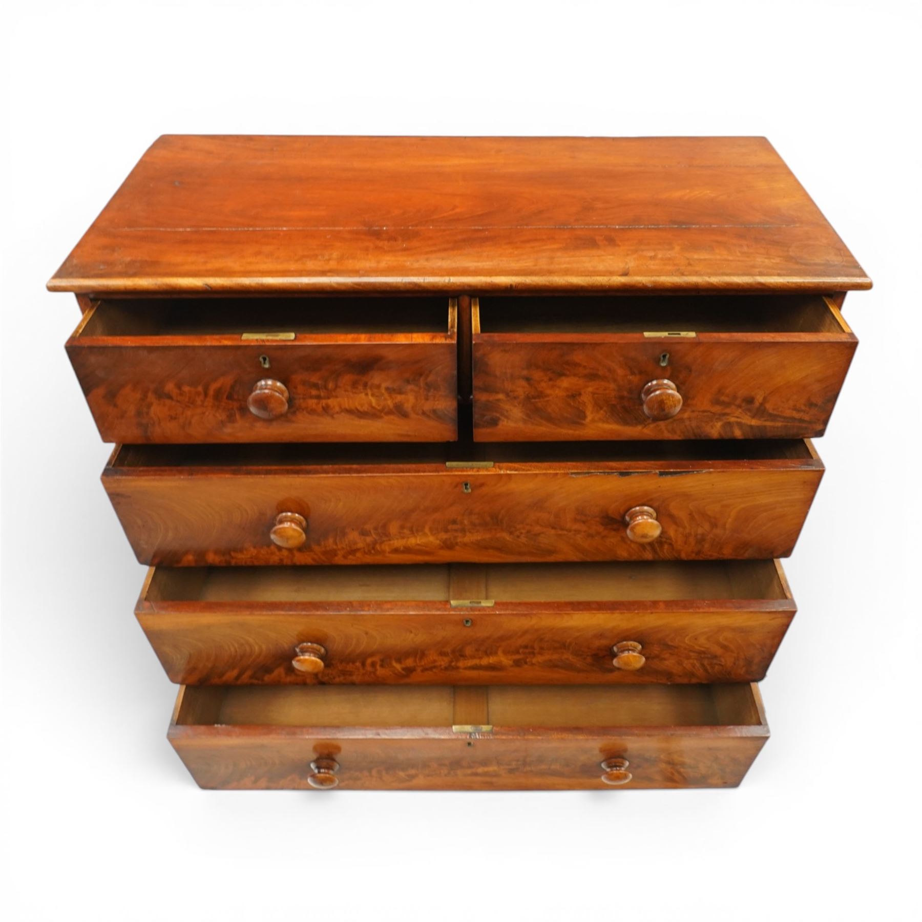 Mid-Victorian figured mahogany chest of drawers, circa 1860, rectangular moulded top over two short and three long drawers with figured veneers, on turned supports