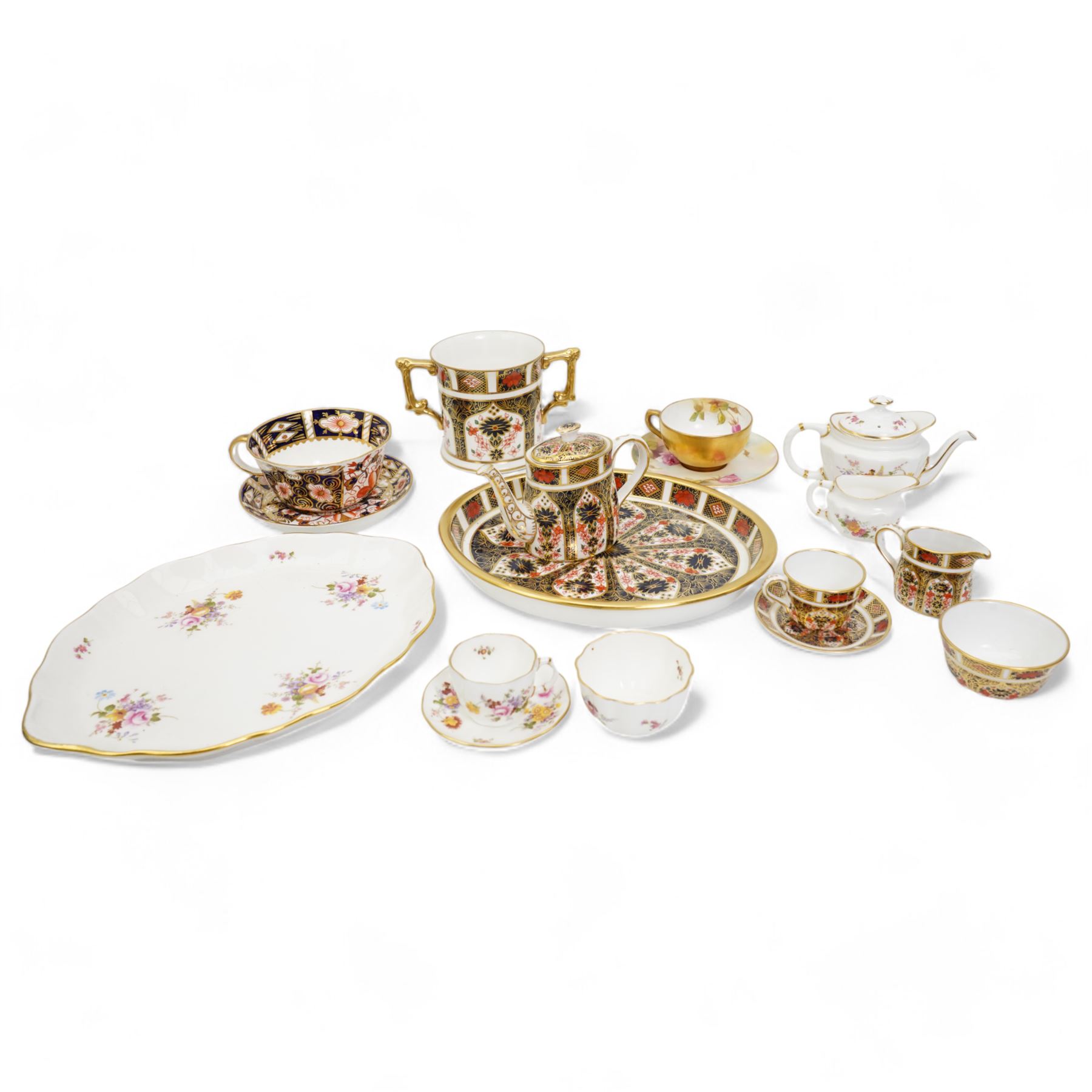 Royal Crown Derby 1128 miniature tea set, Derby Posies miniature tea set, a teacup and saucer, a twin handled mug and Royal Worcester miniature teacup and saucer 