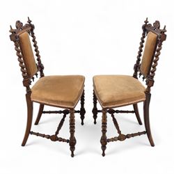 Pair of 19th century oak hall chairs, shield form backs with carved scroll cresting and finial uprights, upholstered in tan velvet, on turned and block supports joined by stretcher rails
