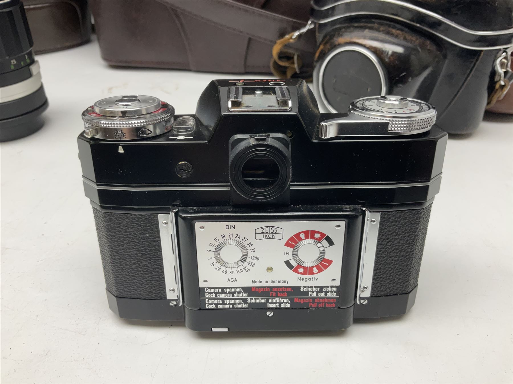 Four Zeiss Ikon camera bodies, to include, Contaflex Super B camera body, serial no. B31591, with 'Carl Zeiss Tessar 2.8/50 lens, serial no.3425553, Contaflex Super BC camera body, serial no. P81728, with 'Carl Zeiss Tessar 2.8/50' lens, serial no 4822280, etc, together with three cased lenses; 'Carl Zeiss Pro-Tessar 1:4 f=115mm' lens, serial no 3734740, 'Carl Zeiss Pr-Tessar 1:3.2 f=85mm' lens, serial no. 3647764 and 'Carl Zeiss Pr-Tessar 1:3.2 f=35mm' lens, and other Zeiss Ikon equipment 