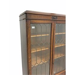 Early 20th century oak bookcase, fitted with two lead glazed doors