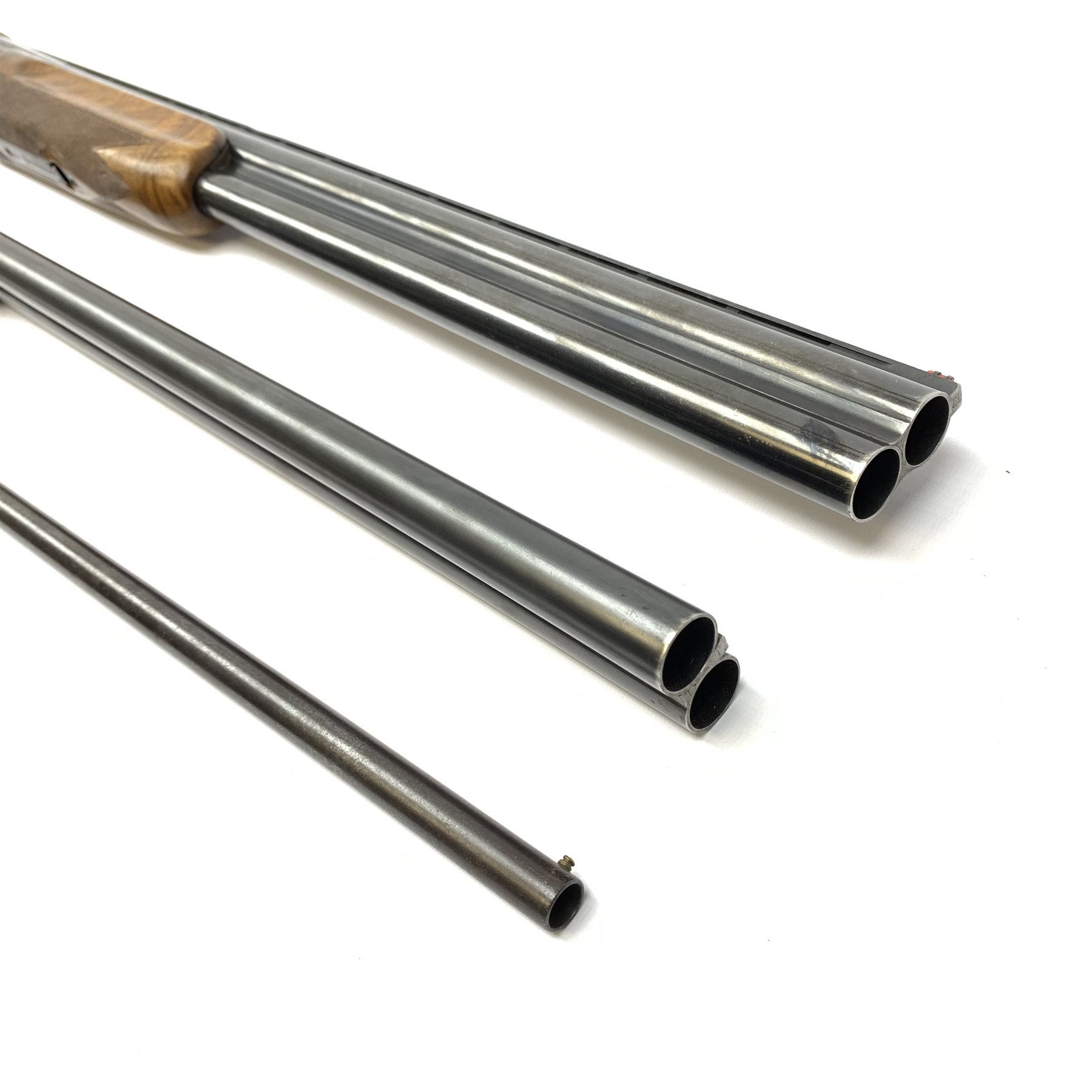 Miroku 12-bore box lock ejector over-and-under double barrel shotgun with walnut stock and 66cm barrels, No.2277306, L112cm overall; Sabel 12-bore box lock non-ejector side-by-side double barrel shotgun with 66cm barrels, No.62546, L108cm overall; Lambert Dumoulin folding .410 single barrel shotgun; and leather 12-bore cartridge belt (4) RFD ONLY