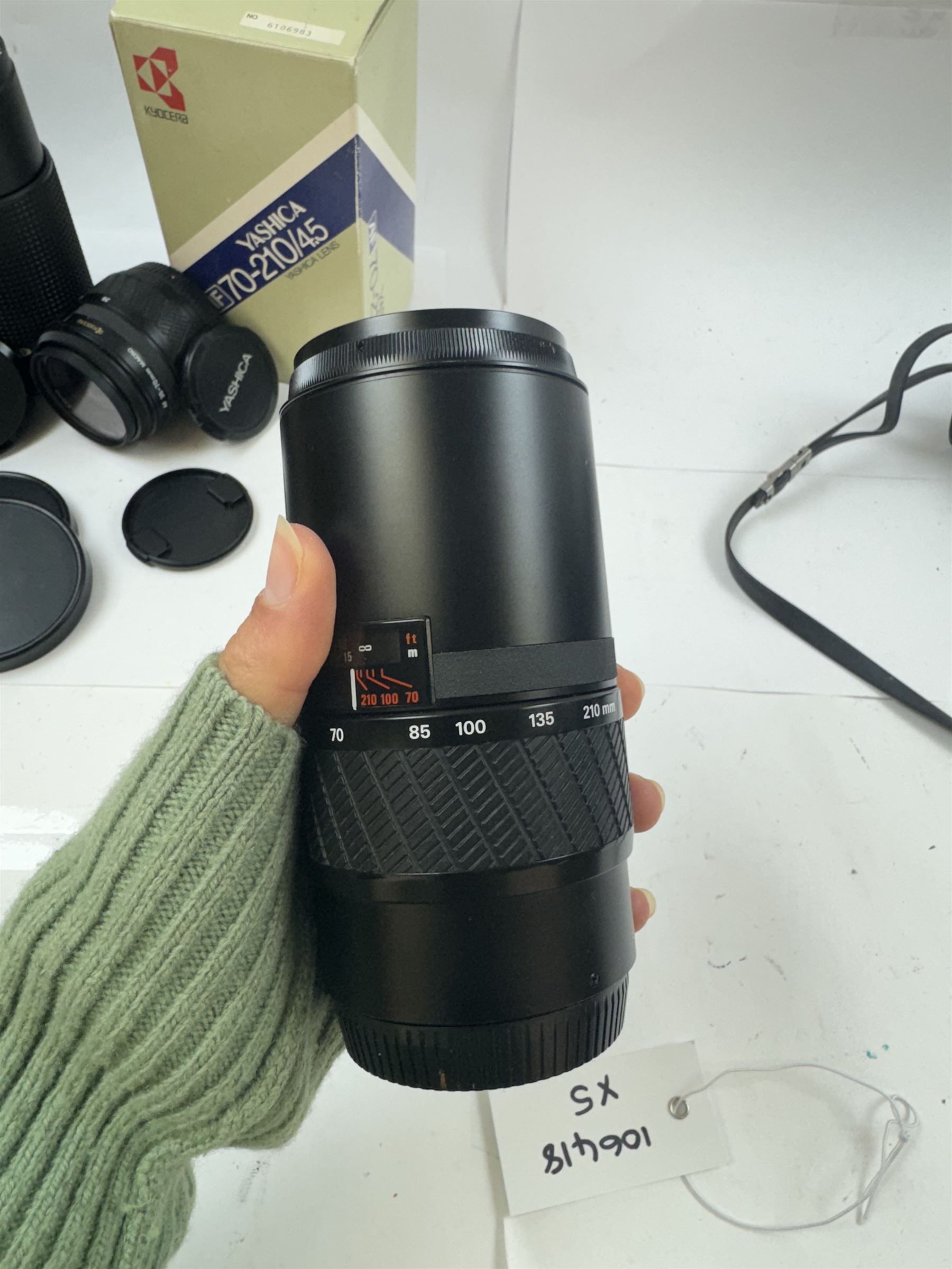 Group of camera lenses, comprising Yashica AF 70-210mm 1:4.5 58mm lens serial no. F6106983, boxed, Yashica AF 35-70mm 1:3.3-4.5 52mm Macro lens serial no. F60231147, Yashikor Aux Wide Angle 1:4 lens and a Yashikor Aux Tele-Photo 1:4 lens, Mamiya-Sekor E 1:2.8 f=28mm serial no. 13427 and a Mamiya-Sekor Zoom E 1:4 f=80-200mm lens serial no. 11271