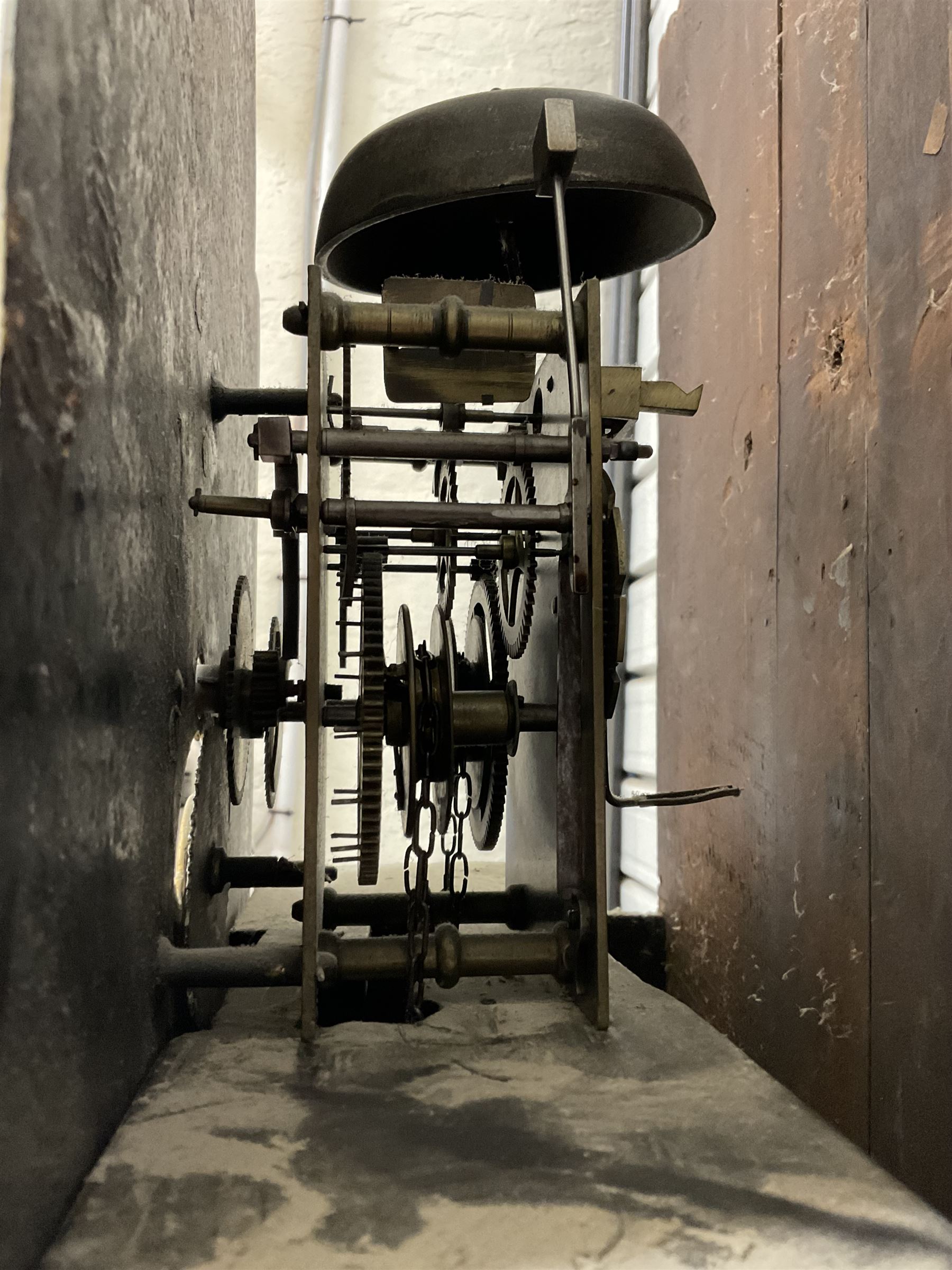 Robert Kneeshaw of Stokesley - 19th century 30 hour mahogany cased longcase clock c1820. with a swans necked pediment and brass paterie, break arch hood door with plain pilasters, inlaid trunk with canted corners, inlay and a wavy topped door, on a rectangular plinth with a shaped base, painted dial with floral spandrels and a depiction of a lady walking in the countryside, with Arabic numerals, non-matching steel hands, calendar aperture and an image of a bird of paradise to the centre, chain driven countwheel striking movement, with weight and pendulum.  