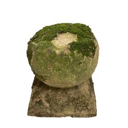 Set of three weathered cast stone gate post finials, circular orb on step-canted square base 