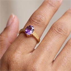 22ct gold amethyst ring, six claw set with a single oval cut amethyst, hallmarked