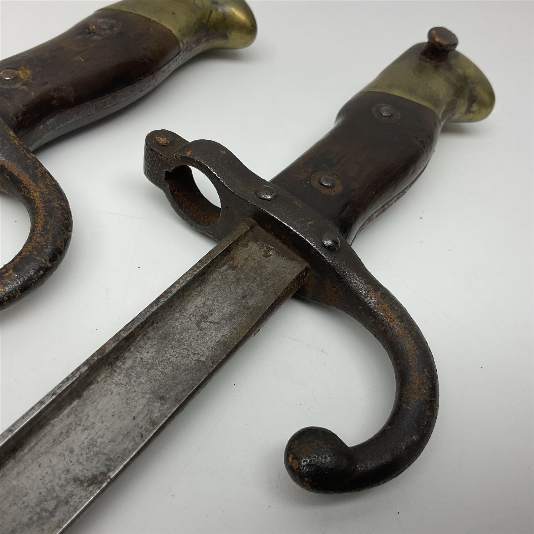 Two 19th century French model 1874 epee bayonets, each with 52cm steel blade, and armoury dates for 1880 and 1881 L64cm overall (2)