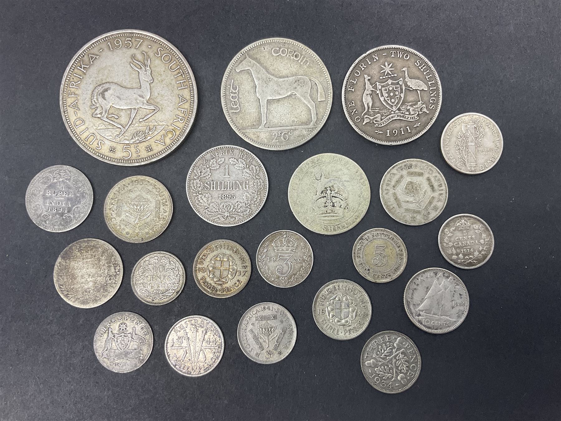 Queen Victoria India 1894 quarter rupee, South Africa 1895 one shilling coin, King George V Australia 1911 one florin - two shillings, Ireland 1928 two shillings sixpence, United States of America 1943 Liberty dime, Queen Elizabeth II South Africa 1957 five shillings and other coinage