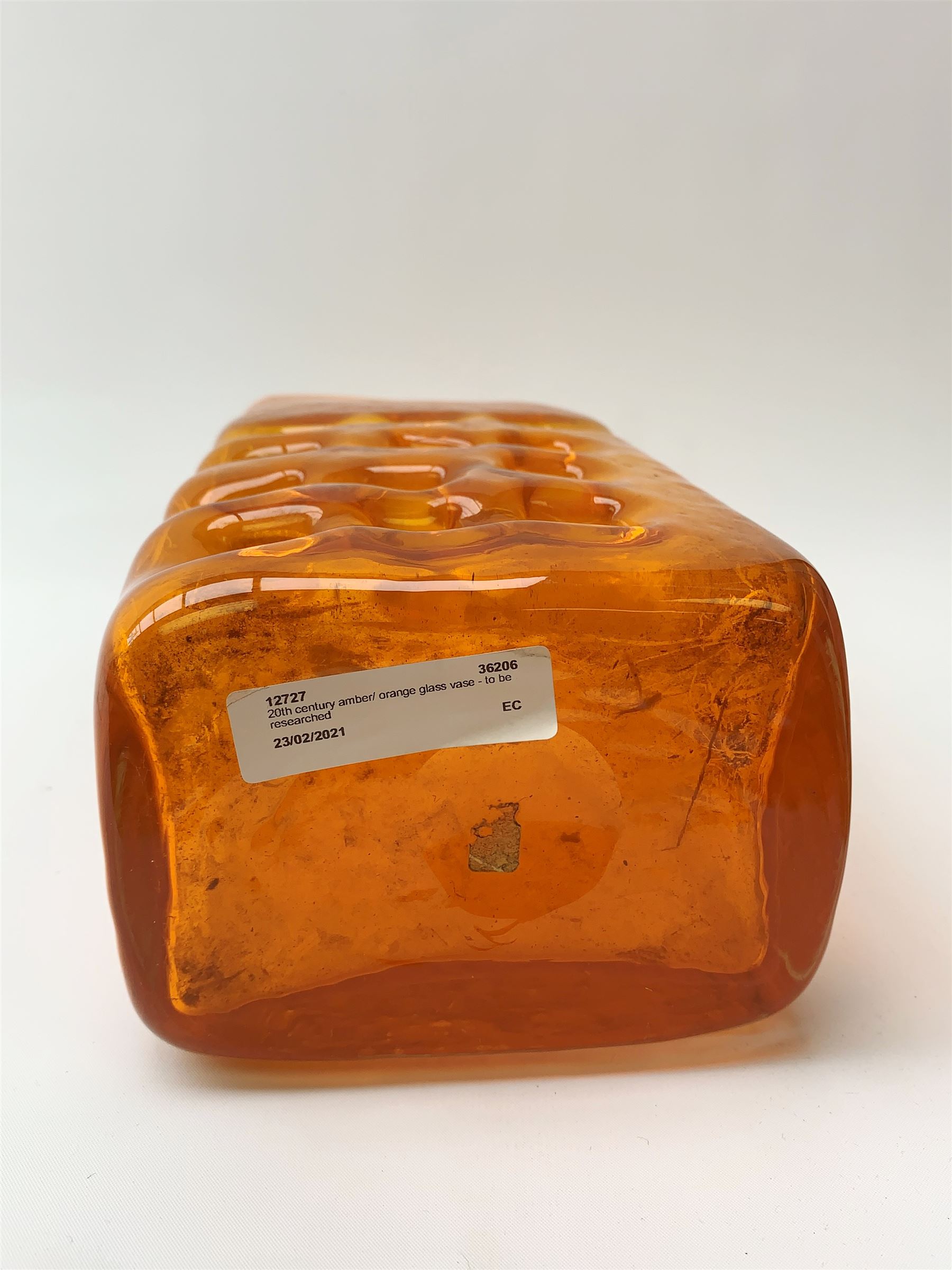 A large Whitefriars tangerine glass Nuts and Bolts vase, with textured finish twelve non-uniform squares to one side, H27cm 
