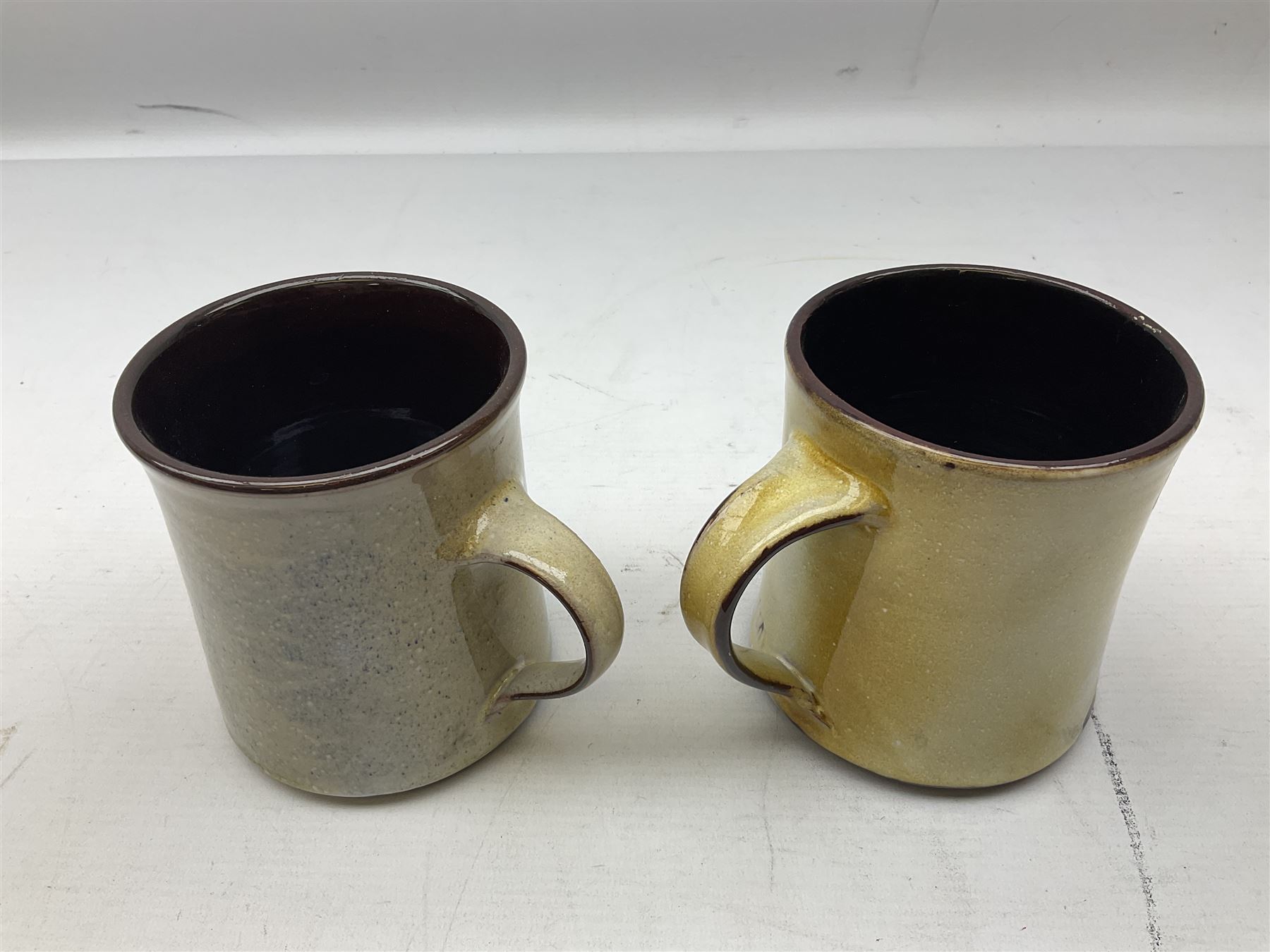 1960s Chelsea Pottery mug decorated with barrister by Joyce Morgan, signed JEM, together with a similar example depicting a doctor, H11.5cm, both signed beneath