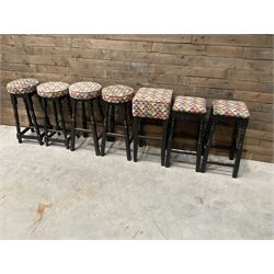 Seven tall bar stools with upholstered seat