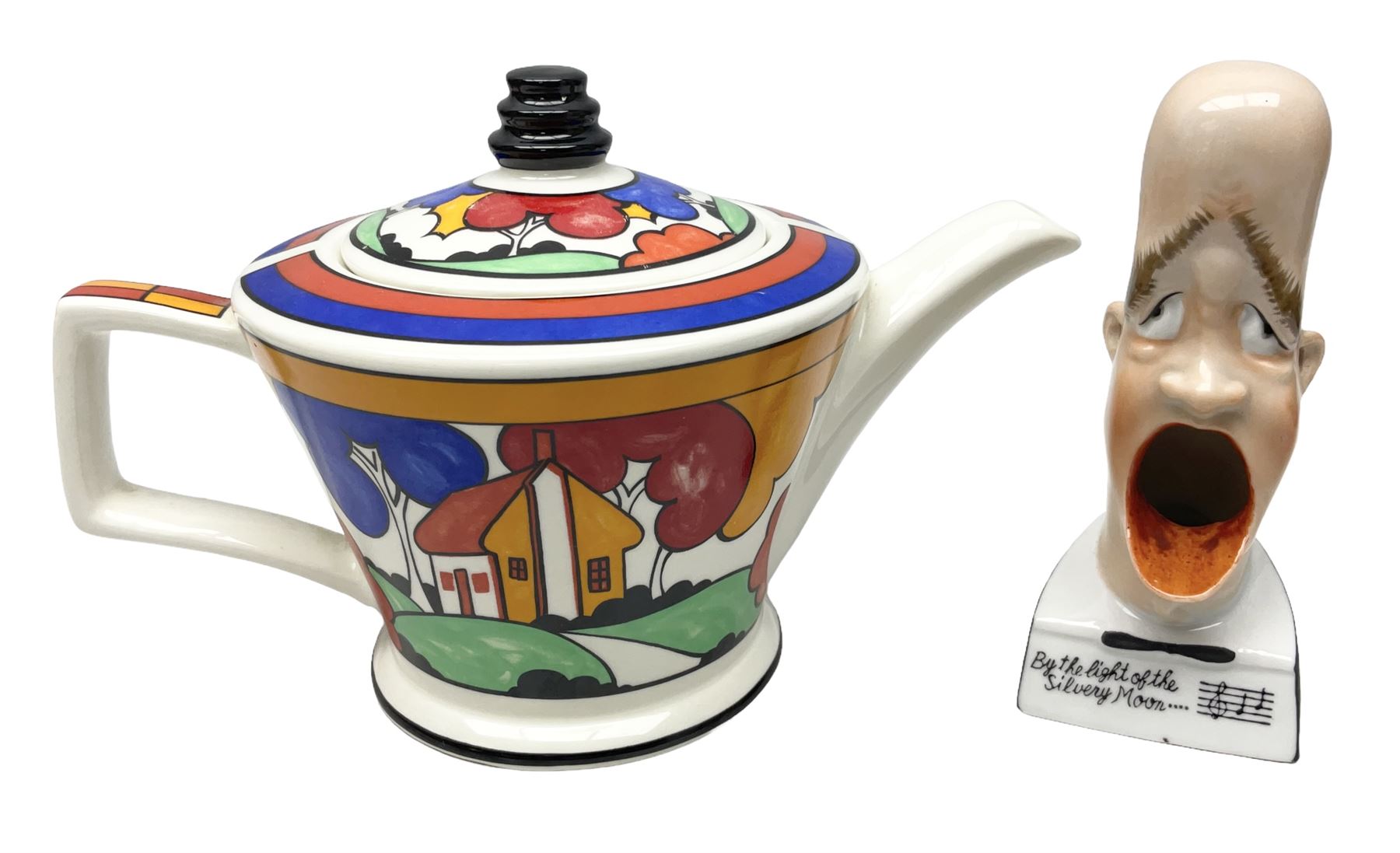 Novelty ashtray modelled as bald headed singer, the base entitled `By the light of the silvery moon...' together with a Sadler teapot of Clarice Cliff Farmhouse pattern style