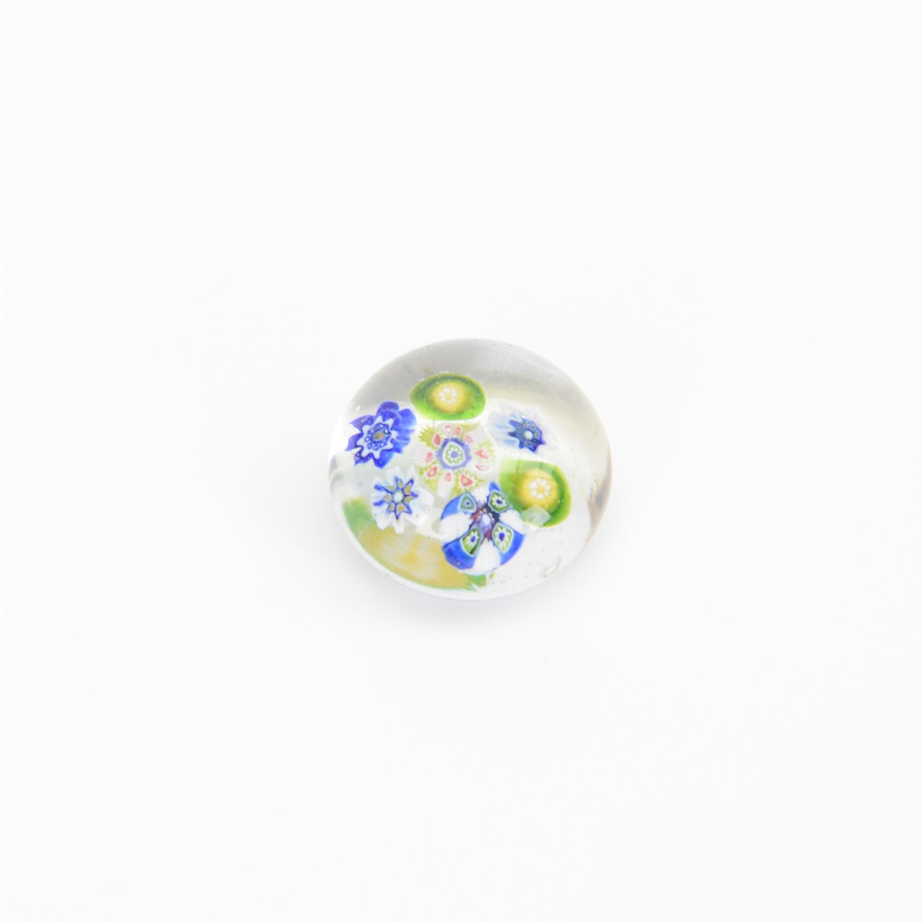 Nine miniature milleifiori paperweights including an example with twisted canes 
