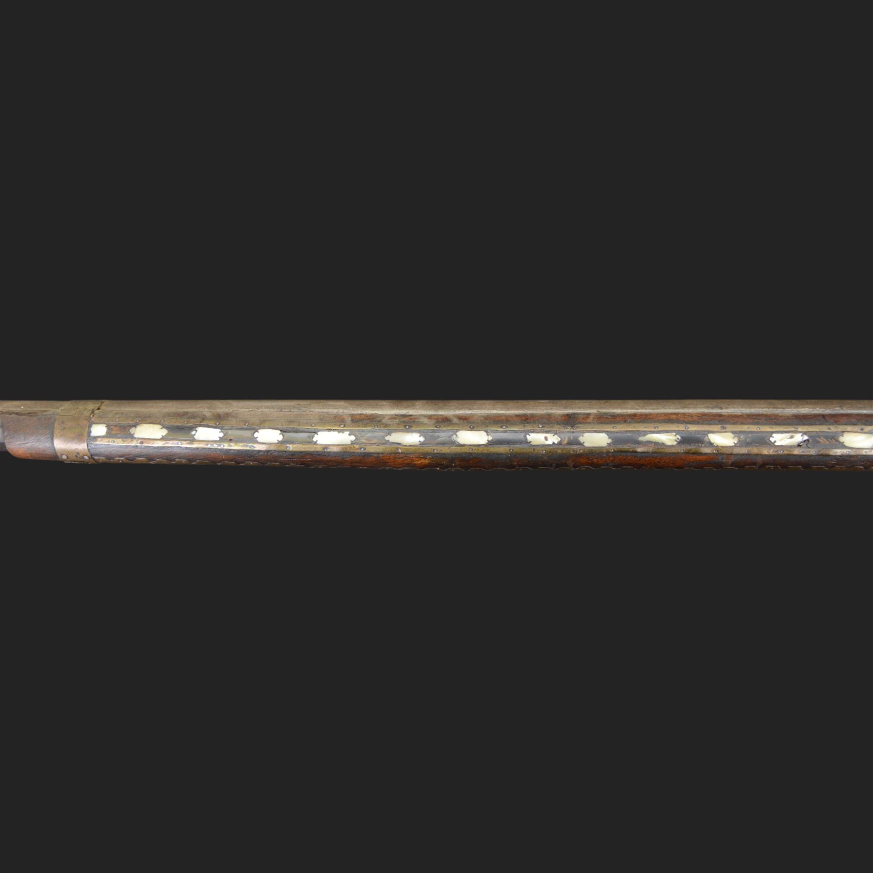Indian Jezail style flintlock musket, with 118cm barrel, the East India Company lock marked 1818,  the curved butt inlaid with mother of pearl and brass decoration, overall L155cm