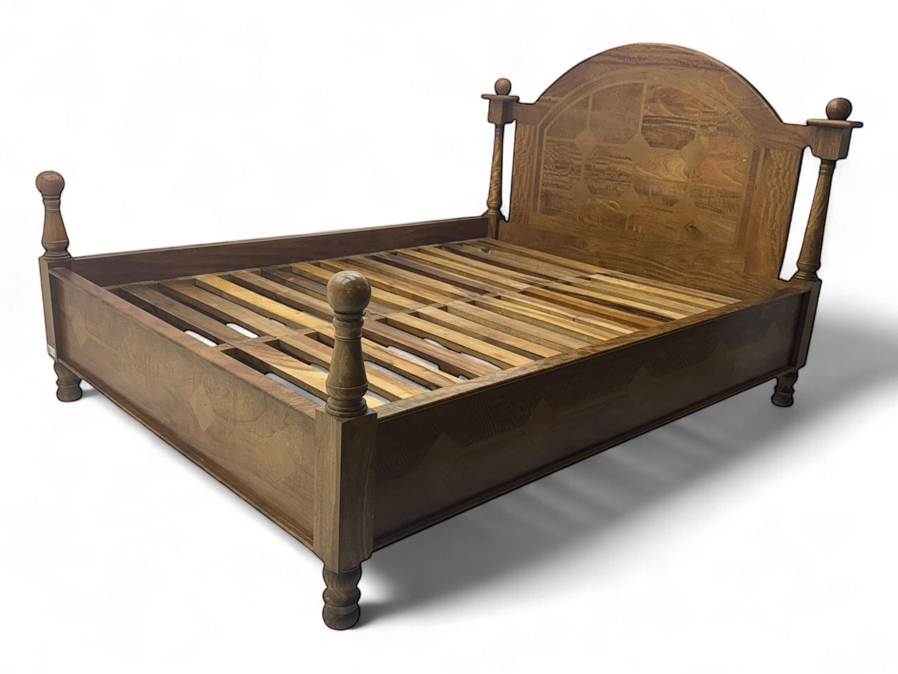 Contemporary mango wood bed frame, comprising an arched panelled headboard and footboard with inlaid geometric patterns, turned posts with spherical finials, and complete with side rails and slatted base