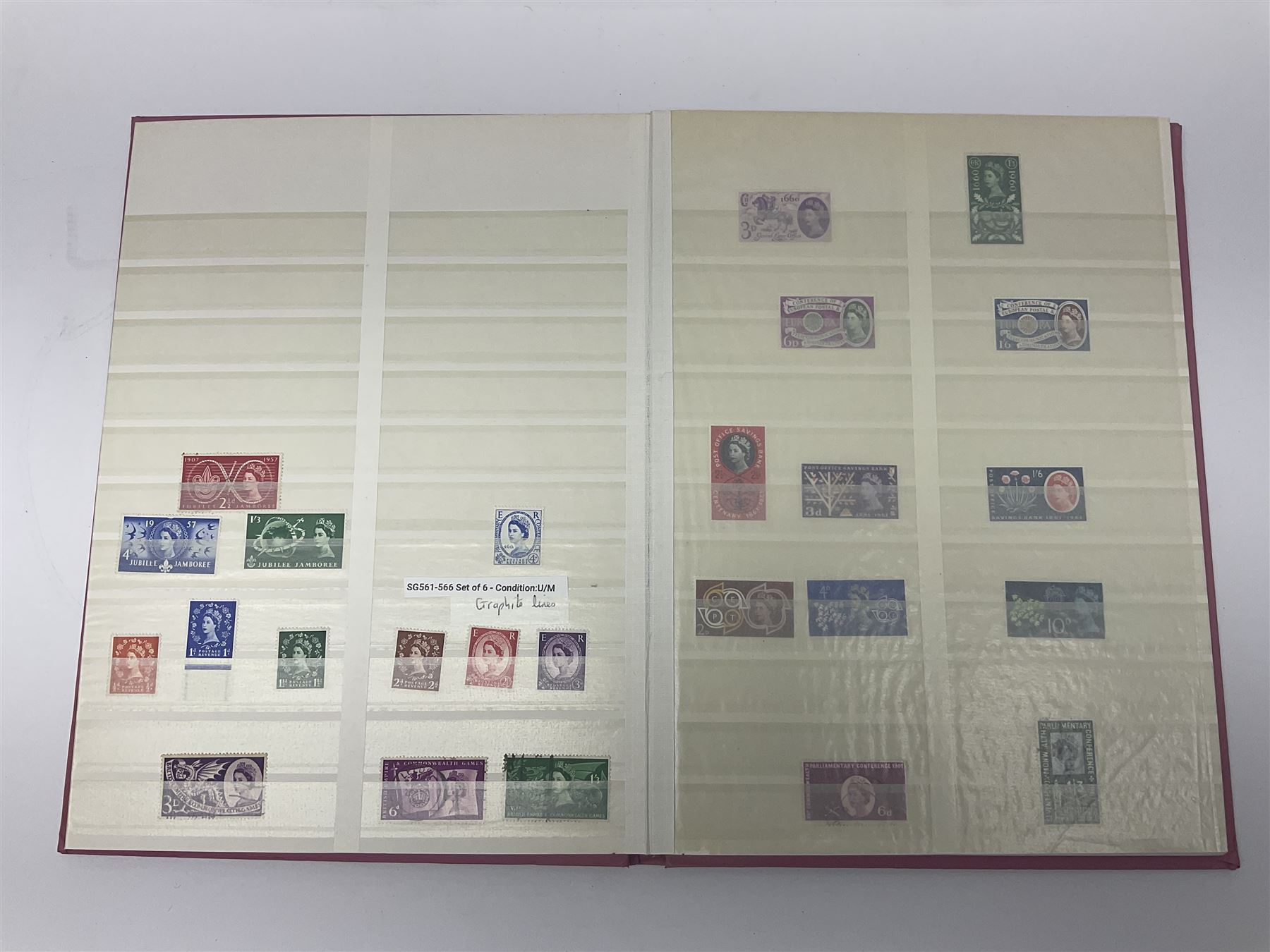 Mostly Great British stamps, including King Edward VII two shillings and sixpence, five shillings and ten shillings, King George V seahorses, King George VI high values, Queen Elizabeth II pre and post decimal etc, housed in a pink stockbook 