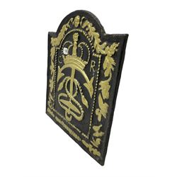 Cast iron fire back, cast with anchor, crown and rope maritime crest, foliage border, gilt and black finish